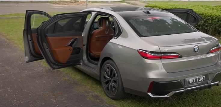 BMW i7 xDrive60 M Sport exterior view with doors open