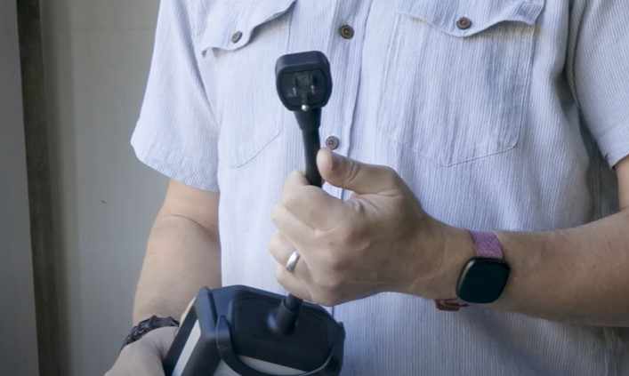 a man hold EV car charger