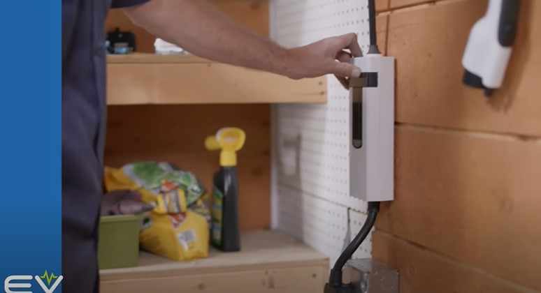 a man installing EV charger at home