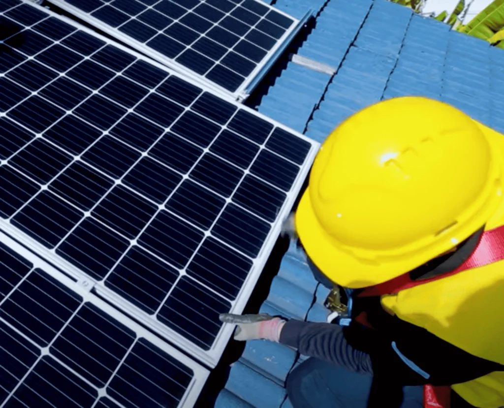 Installation process showing solar panels being mounted on a roof, wired to an inverter, and integrated into the home’s electrical system.
