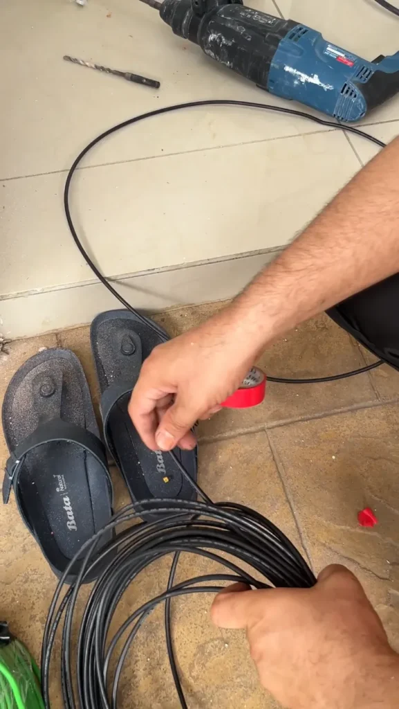 Marking the 6mm2 copper cable with red tape to signify it being the live phase.
